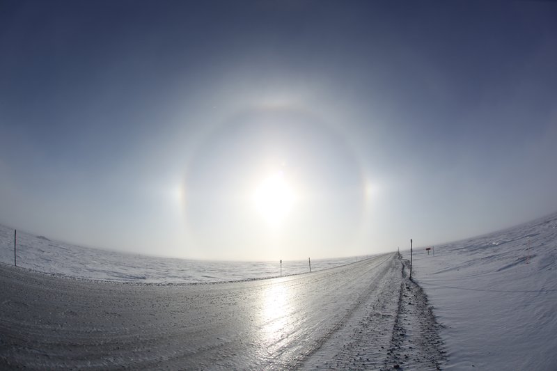Sundogs in tundra along a trans-Alaska pipeline, during mid-winter