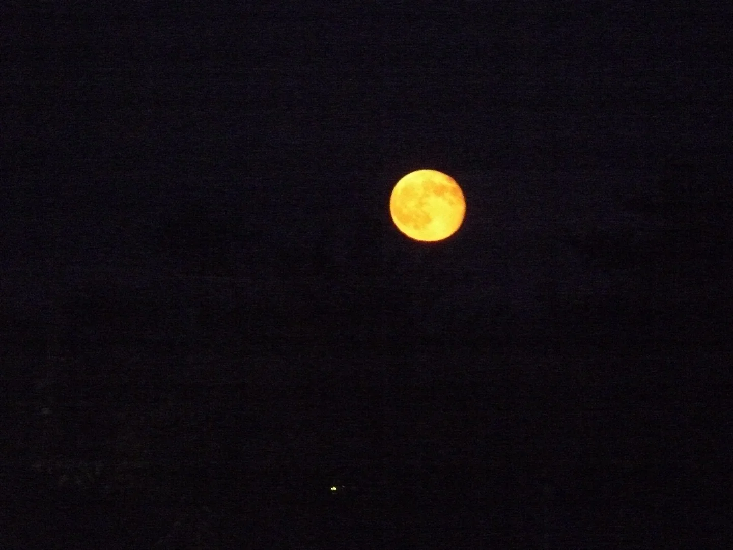 Rising red full moon