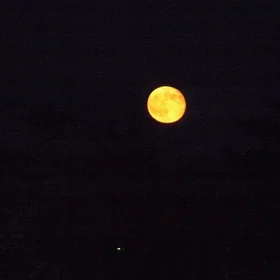 Rising red full moon