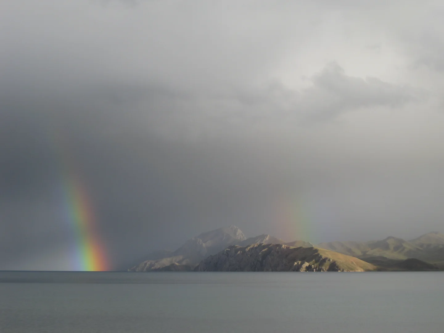 Double rainbow over a Tibetan Plateau lake