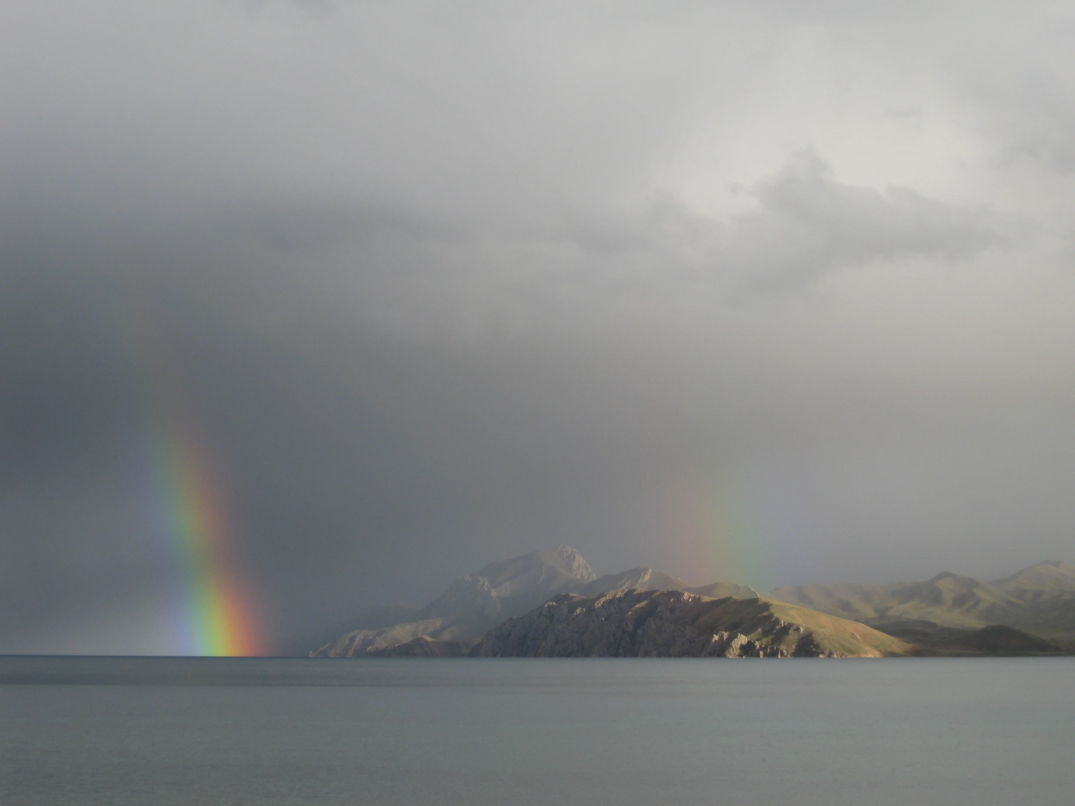 Double rainbow over a Tibetan Plateau lake