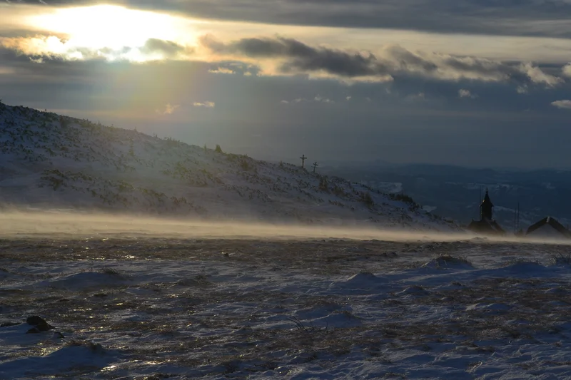 Snow on the road in the sunset