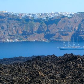 Lava fields on Nea Kameni with Fira, Santorini, in the background