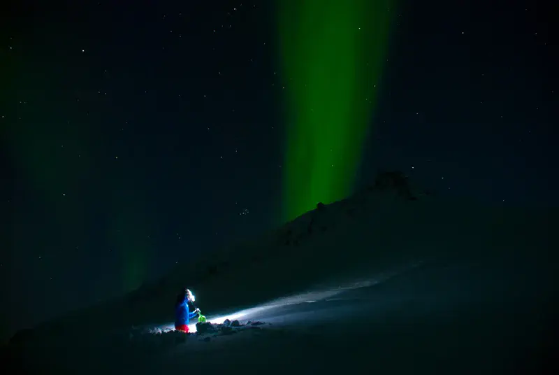 Snow stability testing under Northern Lights