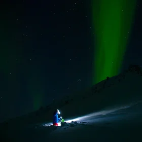 Snow stability testing under Northern Lights