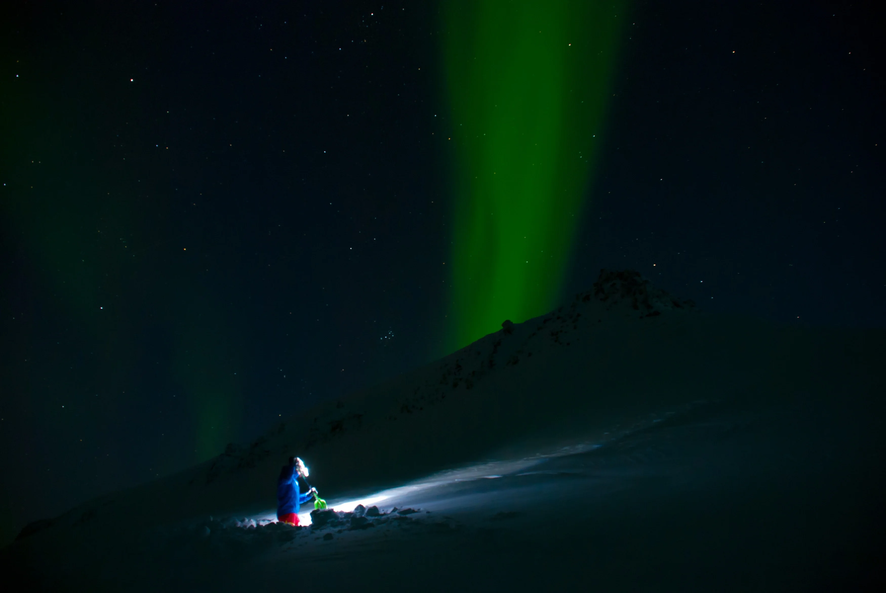 Snow stability testing under Northern Lights
