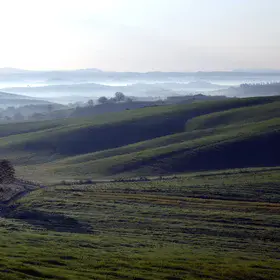 Late-winter sunrise on a hilly landscape in Tuscany (Central Italy)
