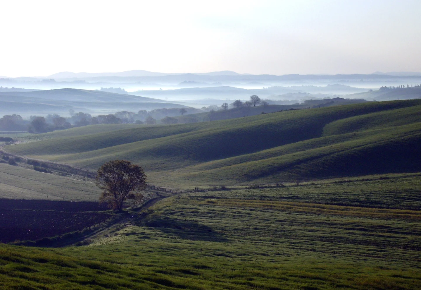 Late-winter sunrise on a hilly landscape in Tuscany (Central Italy)