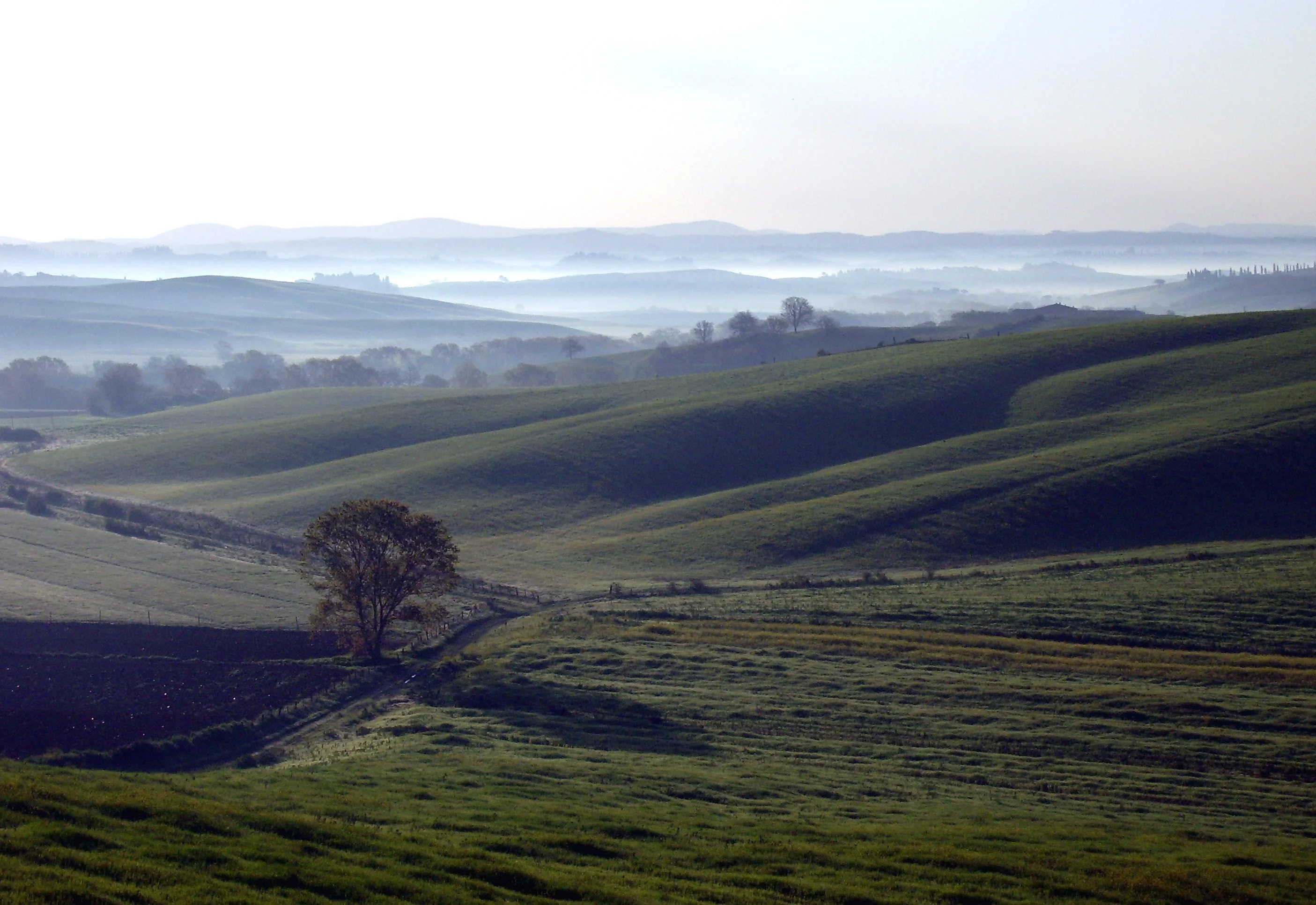 Late-winter sunrise on a hilly landscape in Tuscany (Central Italy)