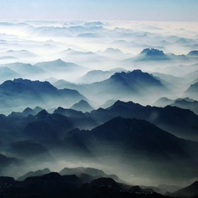 Alpine massifs above low level haze