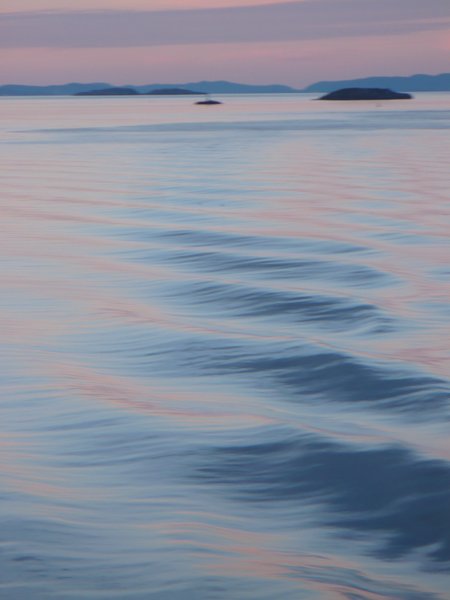 Bow waves at dusk on the Atlantic Ocean near the Norwegian coast