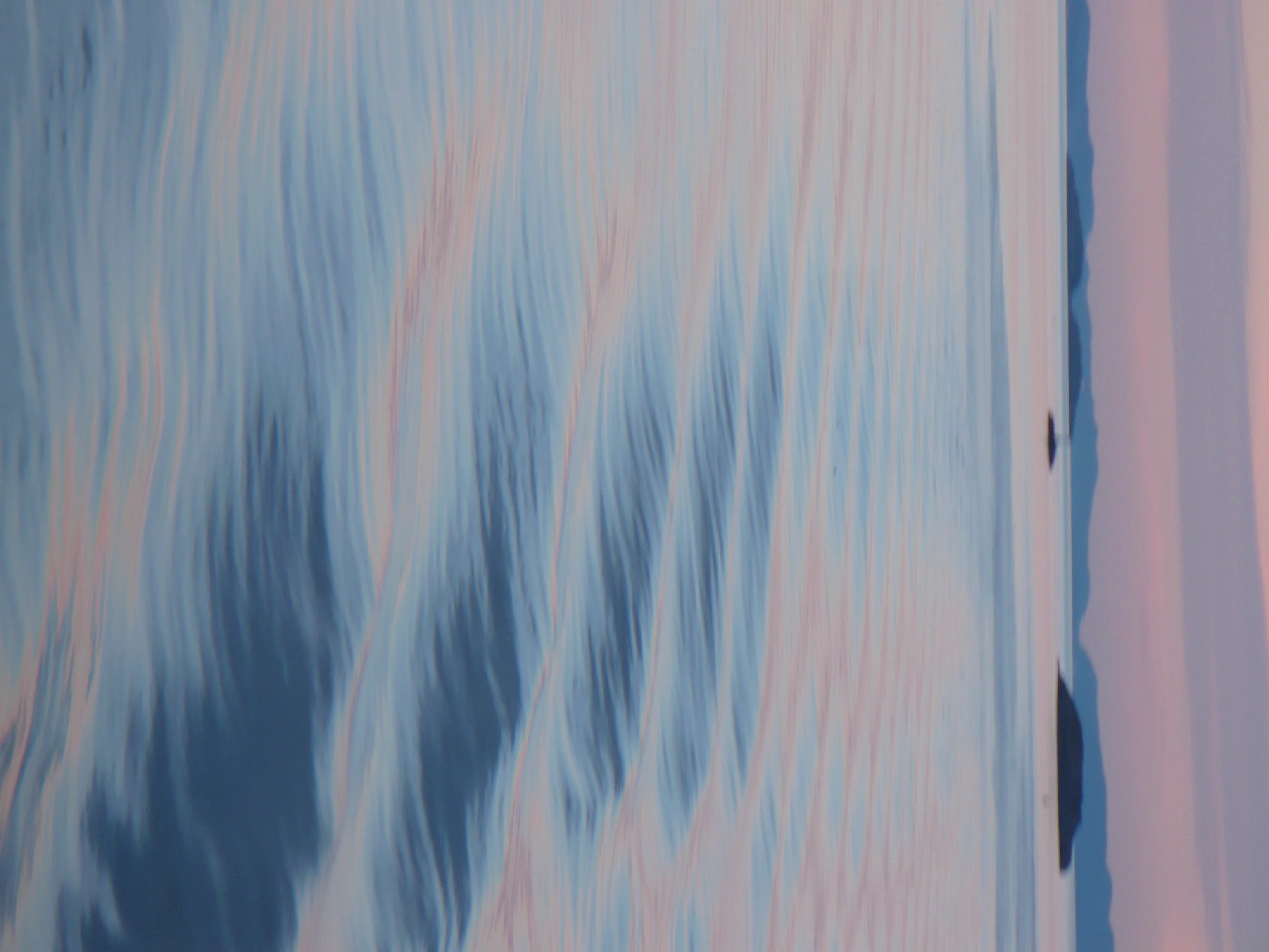 Bow waves at dusk on the Atlantic Ocean near the Norwegian coast
