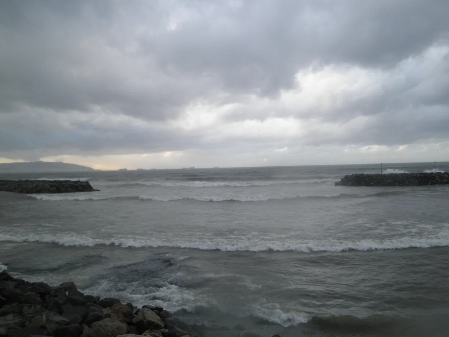 The diffraction of sea waves by a slot in a marina