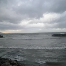 The diffraction of sea waves by a slot in a marina