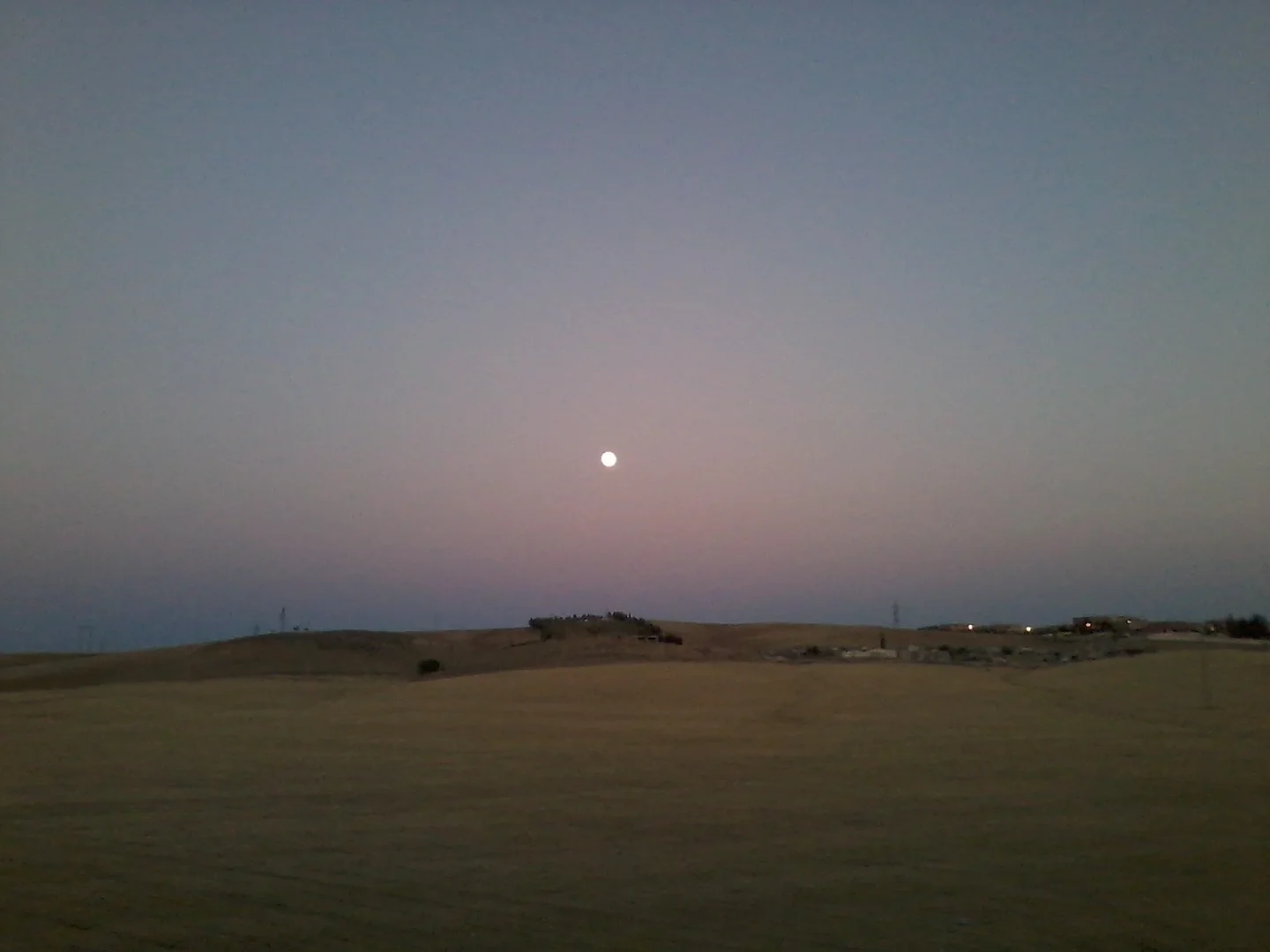 Sun or Moon? It is a Full moon rising on Bouira city