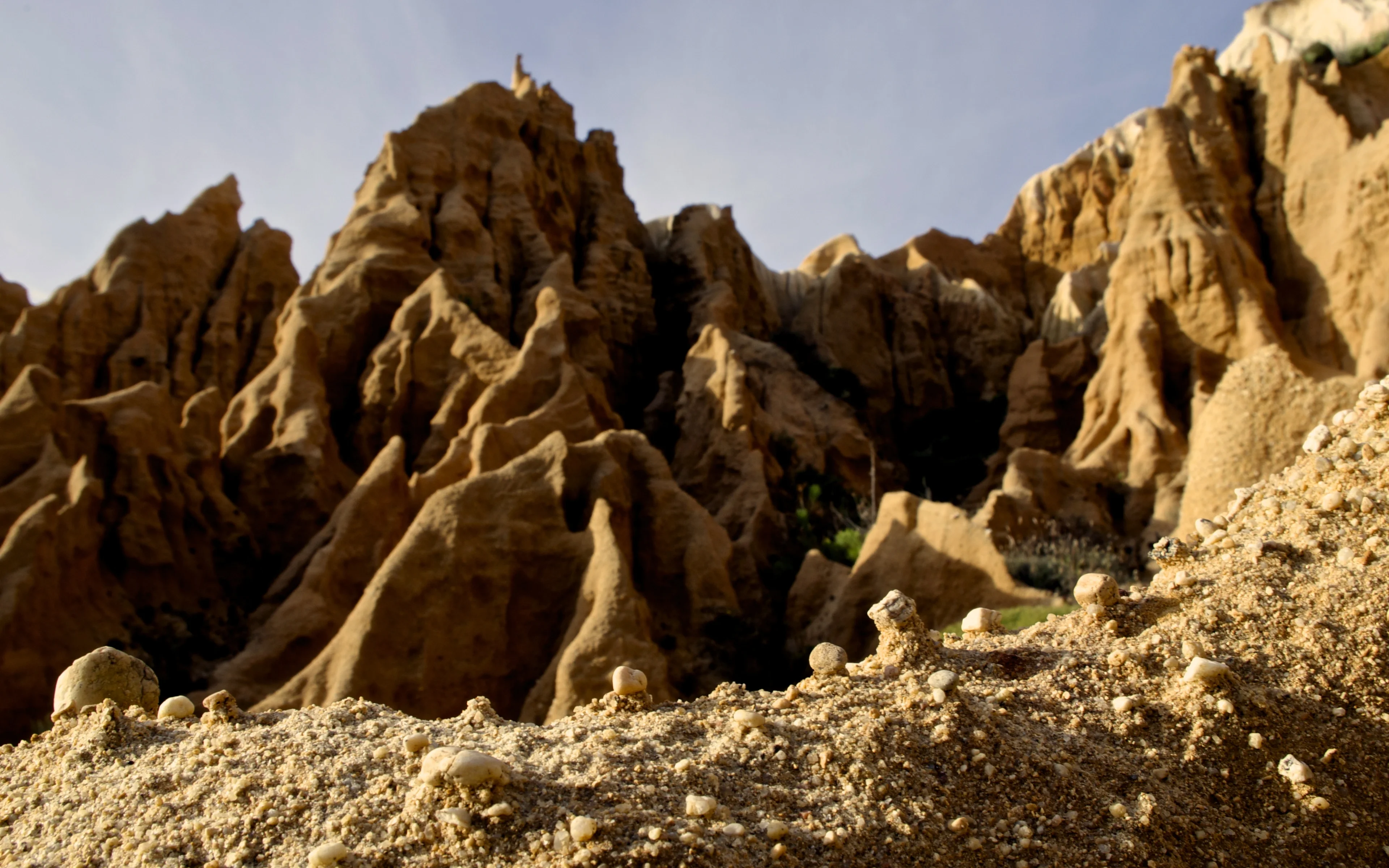 Small scale processes, large scale landforms