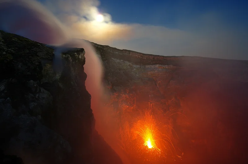 Full moon over Etna's fire