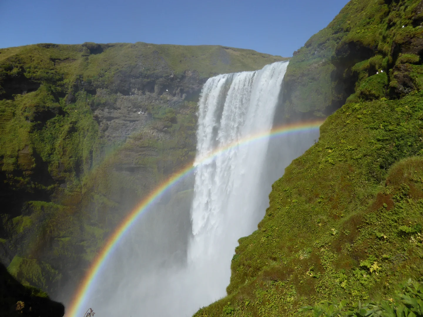 Skógafoss waterfall on a sunny day