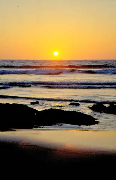 God's eye: sunset at the beach