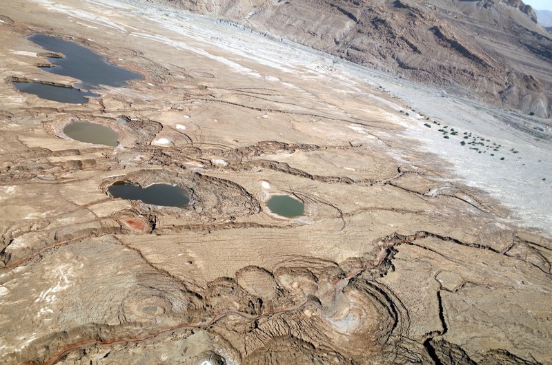 Sinkhole sideview from an aerial survey at the Dead Sea shoreline