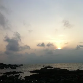 sweet couple enjoy the sunset in Goa