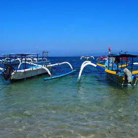 Sparkling blue waters invaded by human boats