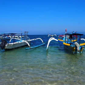 Sparkling blue waters invaded by human boats