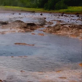 Strokkur geysir prepares its eruption