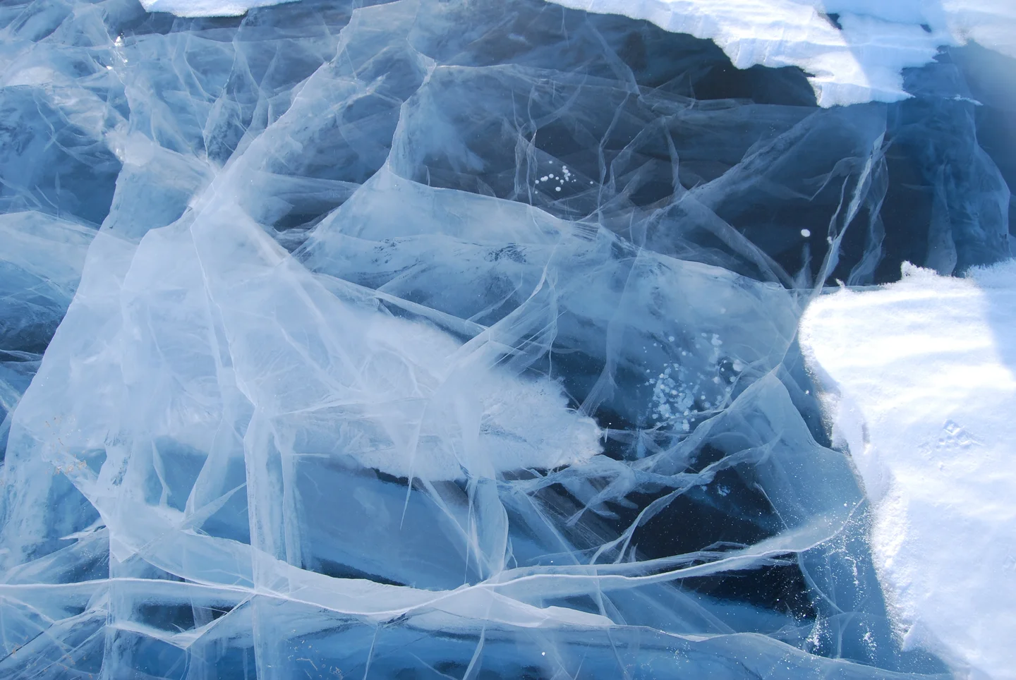 Fractured lake ice with small gas bubbles