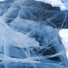Fractured lake ice with small gas bubbles