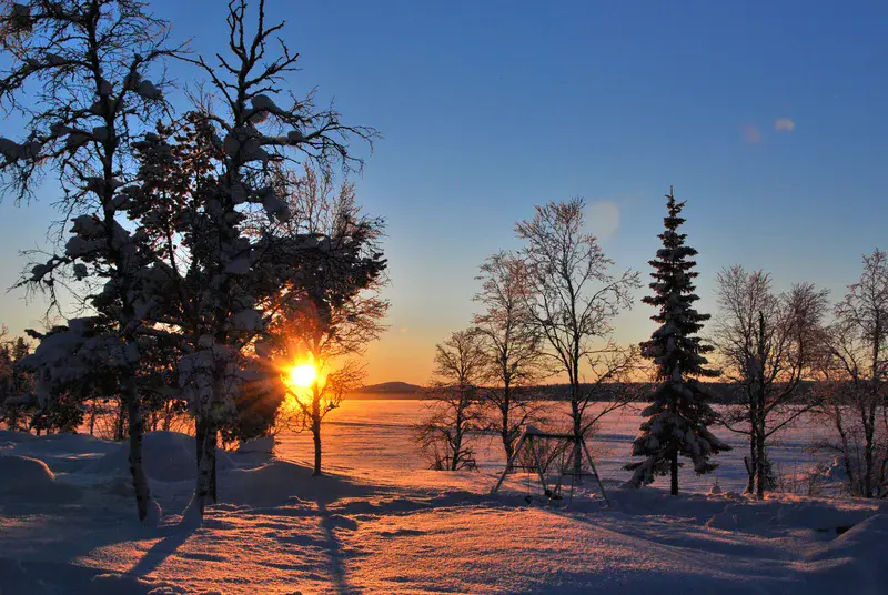 Warm sunrise over a frozen lake