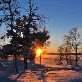 Warm sunrise over a frozen lake