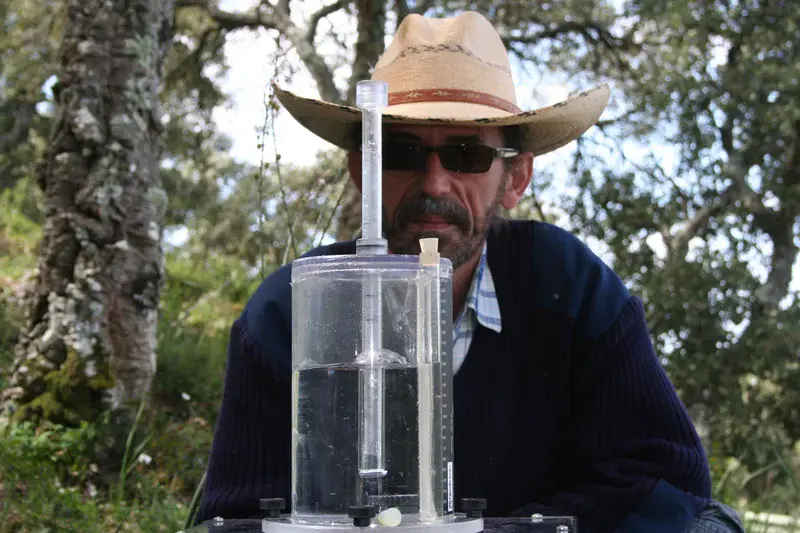 Soil scientists in action: Arturo (and his hat) performing a rainfall simulation experiment