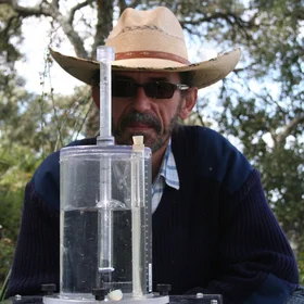 Soil scientists in action: Arturo (and his hat) performing a rainfall simulation experiment