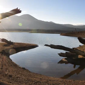 Sunset, LLaima volcano and eruptions' relicts