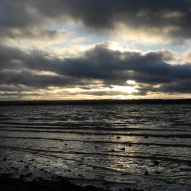 Play of rays at waves on water and in clouds