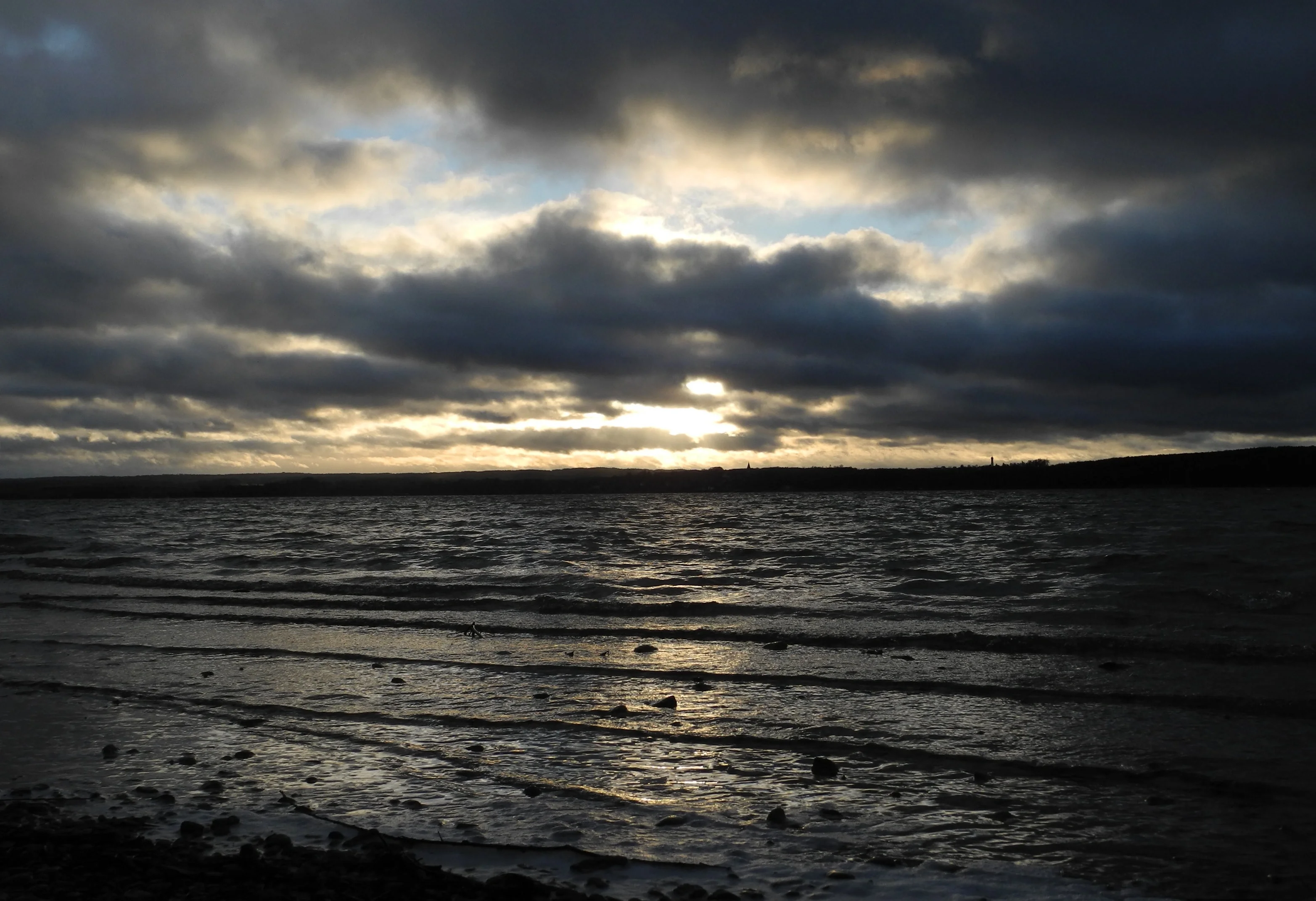 Play of rays at waves on water and in clouds