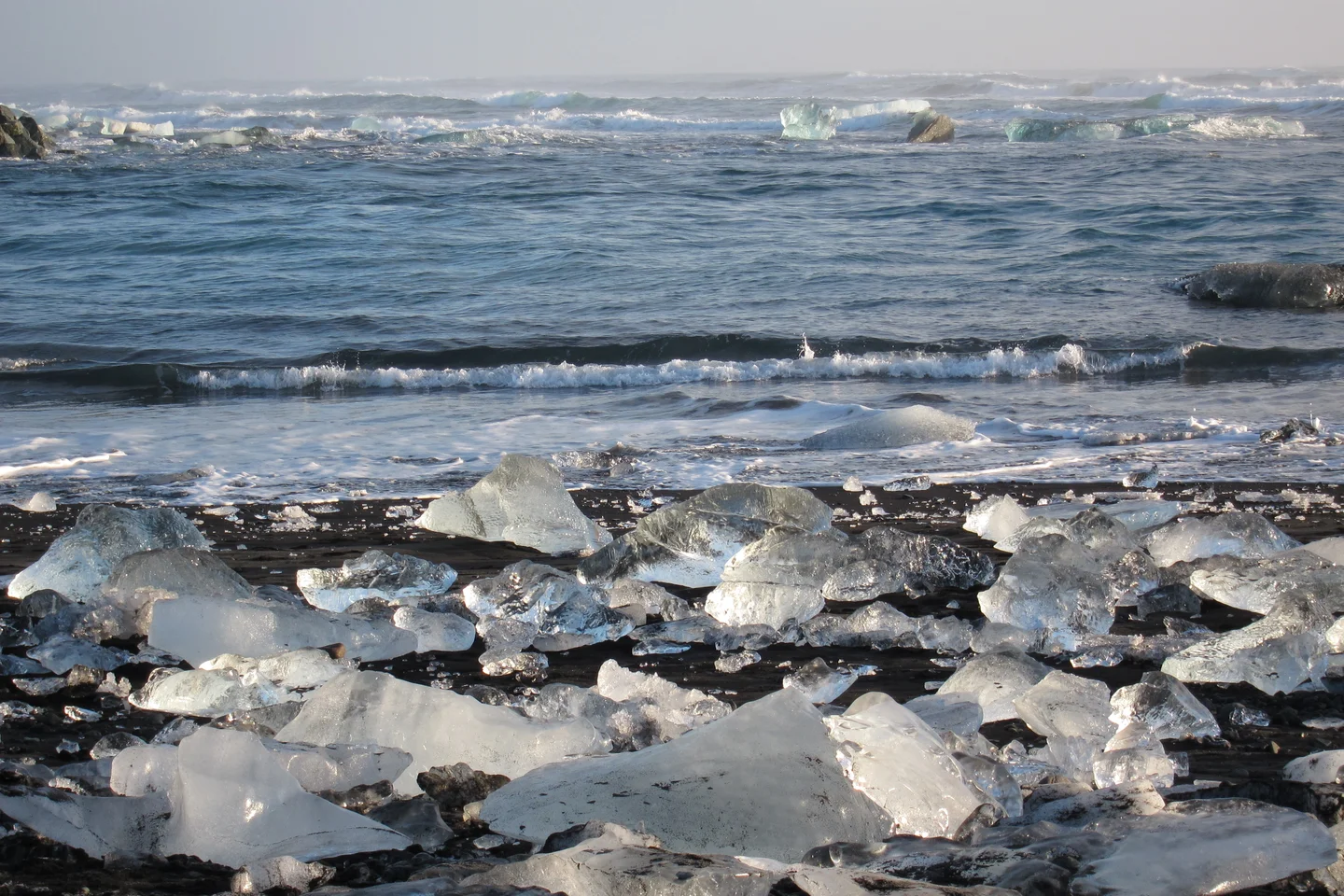 Ice, sand and sea at sunrise.