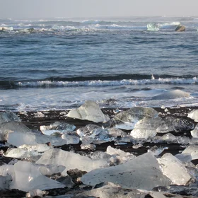 Ice, sand and sea at sunrise.