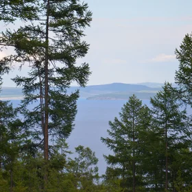 Different feeling. Blue lake from back of forest curtain.
