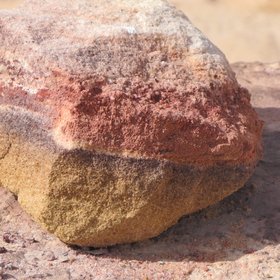 A stone with colored layers of sand from the Jurassic period