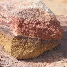 A stone with colored layers of sand from the Jurassic period