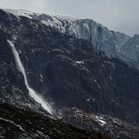 Glacial waterfall from hanging glacier