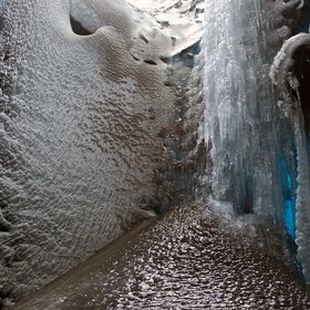 Volcanic ash frozen within a glacier mill