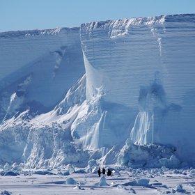 Dwarfed by a grounded iceberg
