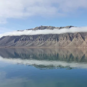 Amazing reflection of Spitsbergen Wijdefjorden in the Svalbard, the Arctic