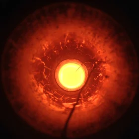 Peridotite melt spreading light in the oven