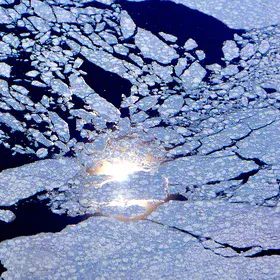 Sun reflection behind sea ice