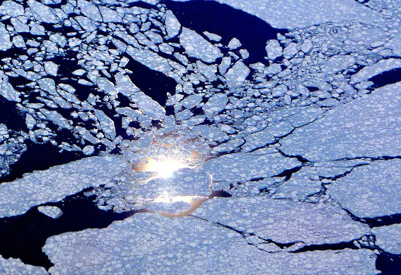 Sun reflection behind sea ice