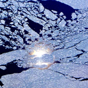 Sun reflection behind sea ice